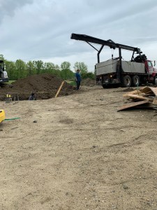 Getting ready to place the septic tank in the hole