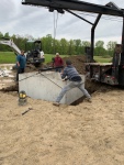Lowering the septic tank into place